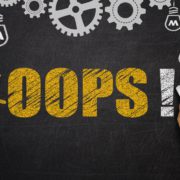 'Oops!' written in chalk on a chalkboard surrounded with gears and lightbulbs